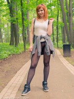 Jeny wearing seamless pantyhose walking outdoors