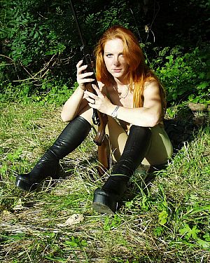 pics 6 of Hot Redhead Huntress Relaxes in The